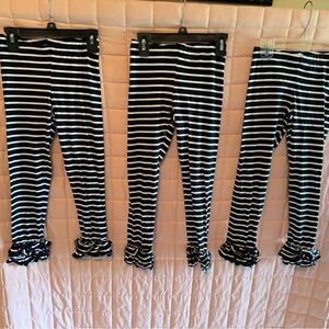 Black and White Striped Ruffle Leggings
Price for all 3. Will sell separately.